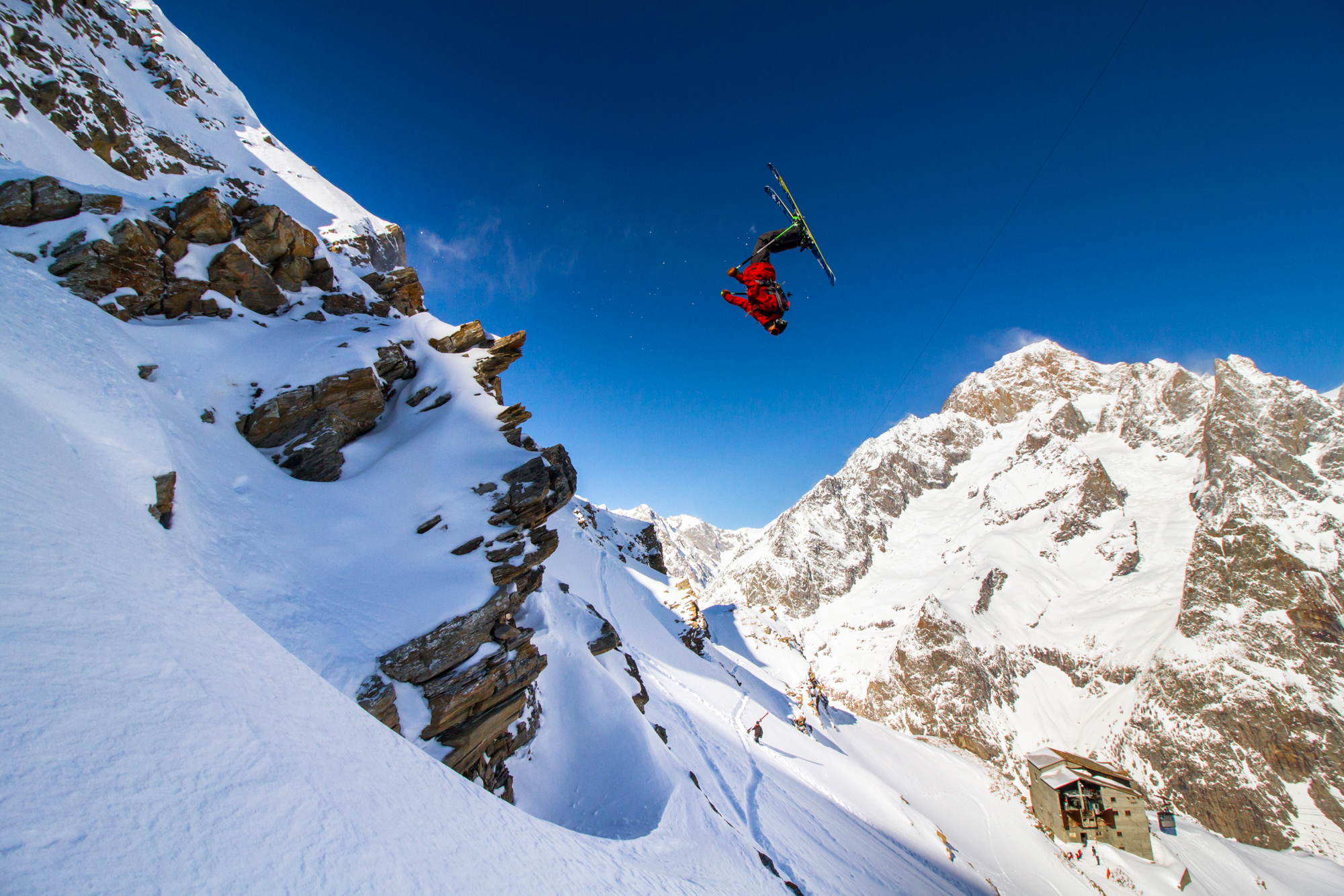 Ethan Stone by Tom Ritsch - skier jumping off a cliff in Courmayeur