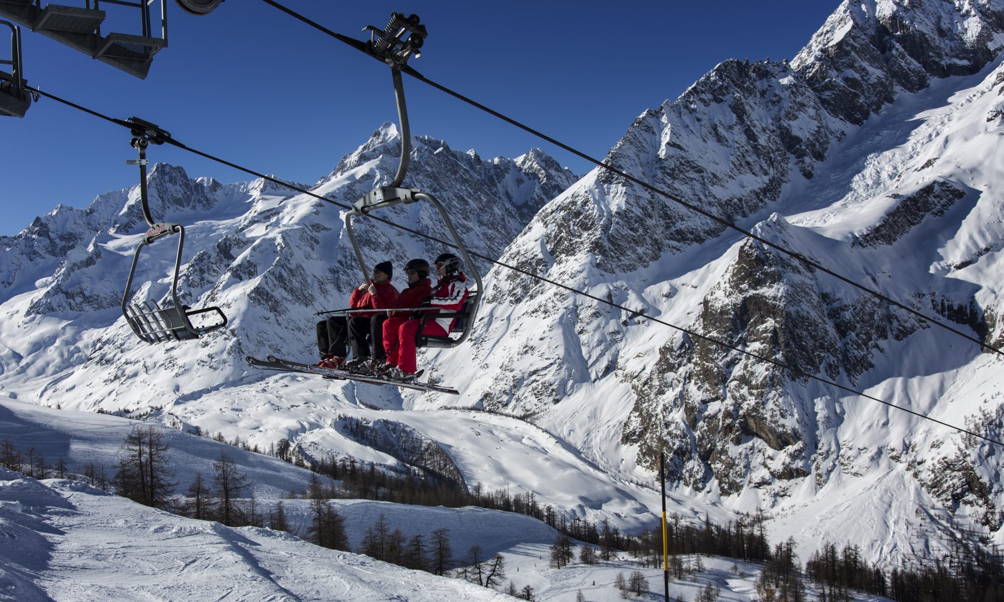 Chairlift ride up in Courmayeur Mont Blanc. Courmayeur Mont Blanc Funivie is opening two new slopes with amazing panoramic views.
