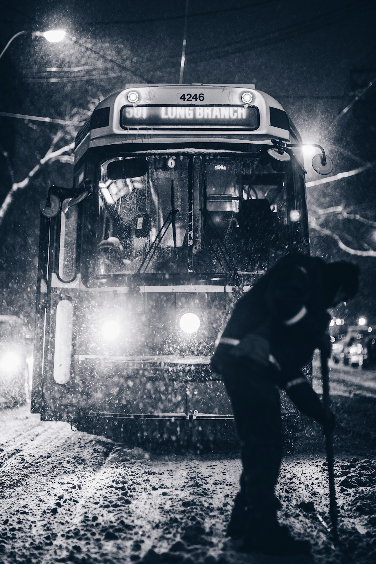 Driving Bus stuck in the snow- Scott Walsh photo - Unsplash. Driving to the mountains. Winter tyres, snow chains
