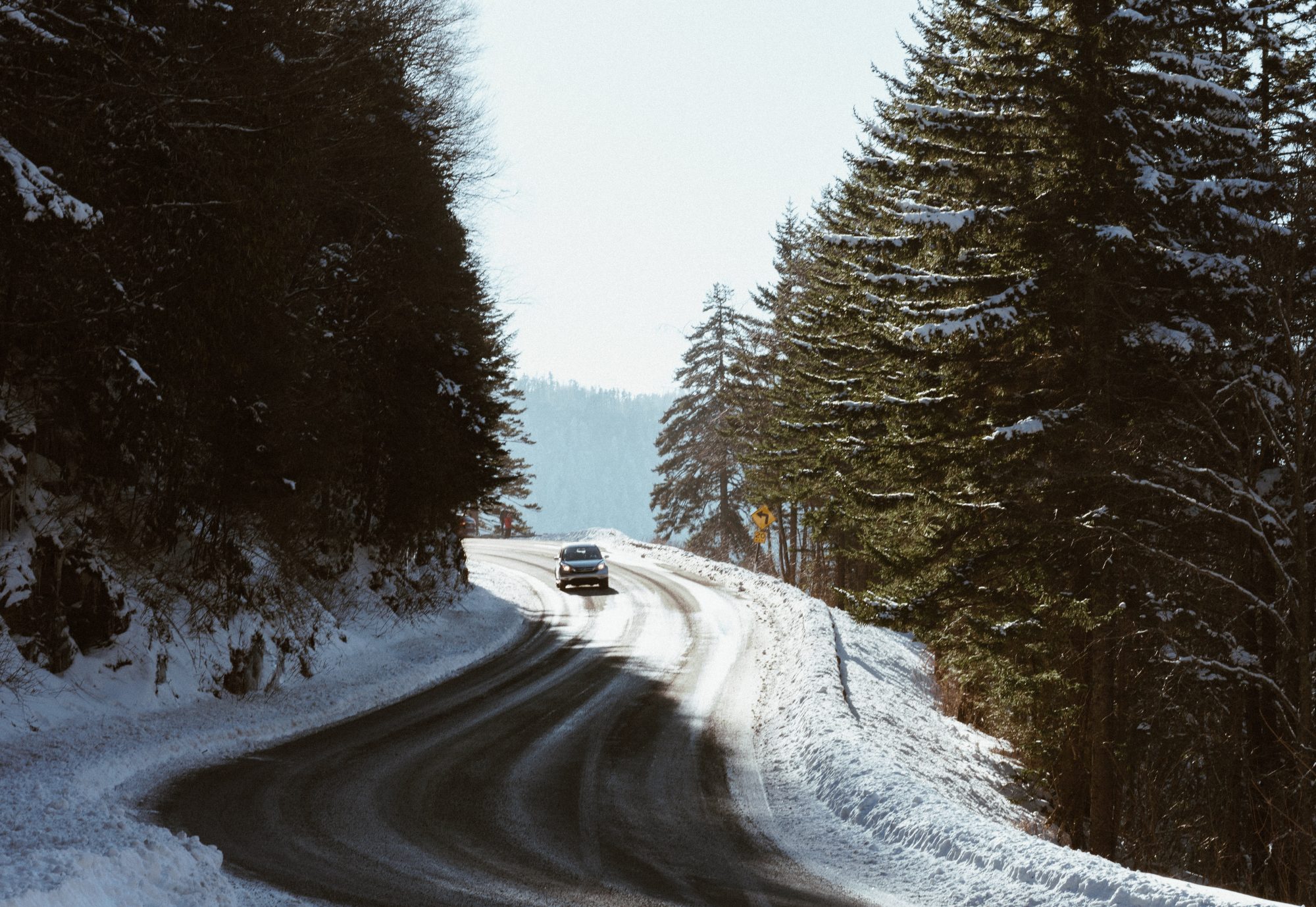 Driving to the mountains- check if you need to have snow tyres and snow chains. Photo Jeffrey Wegrzyn- Unsplash. Winter tyres, snow chains. Driving to the mountains