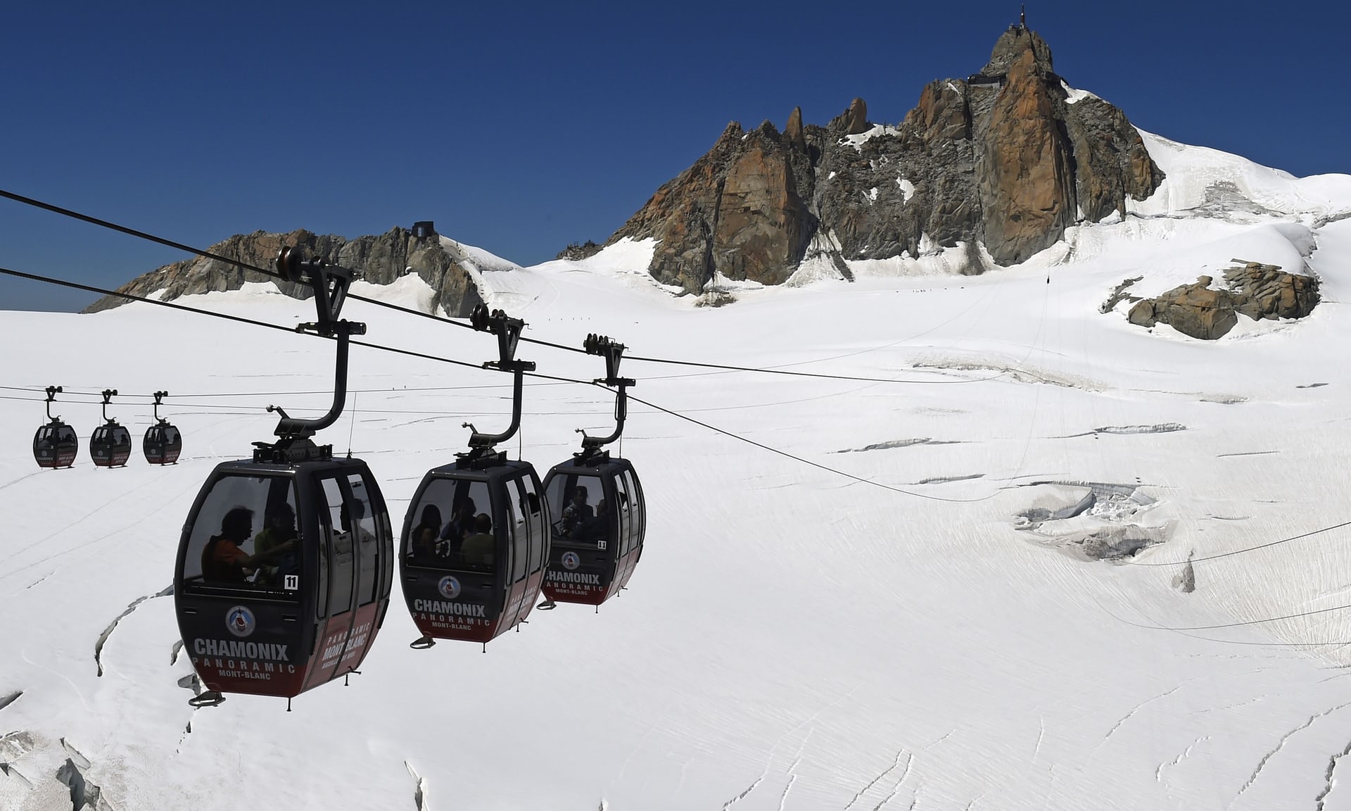 The gondolas that go on top of the Mar de Glace, from Aiguille du Midi in France (Chamonix) to Punta Helbronner in Italy (Courmayeur)
