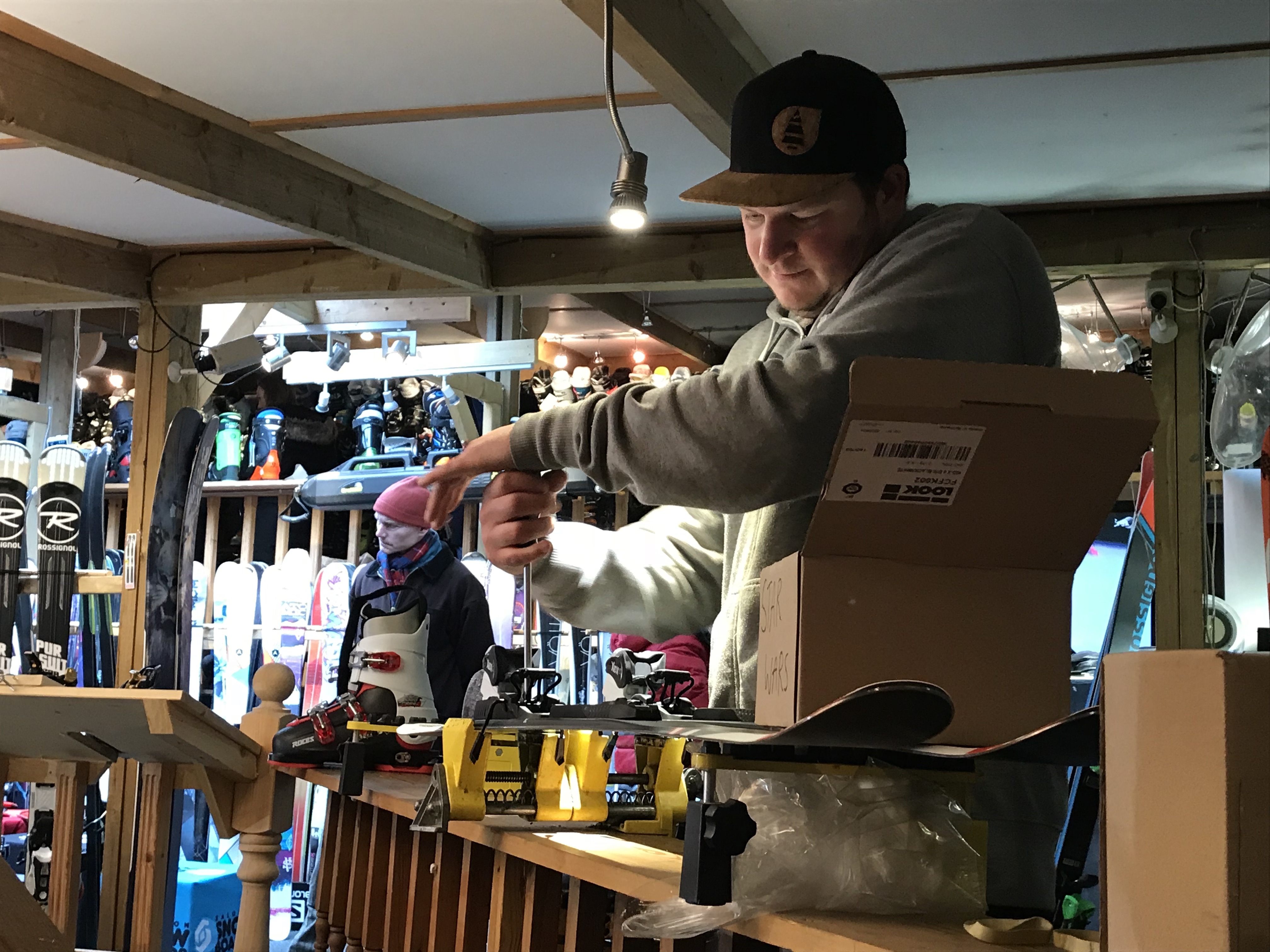 Bradley setting up the bindings in the boys' skis - Finches Emporium - Photo by The-Ski-Guru