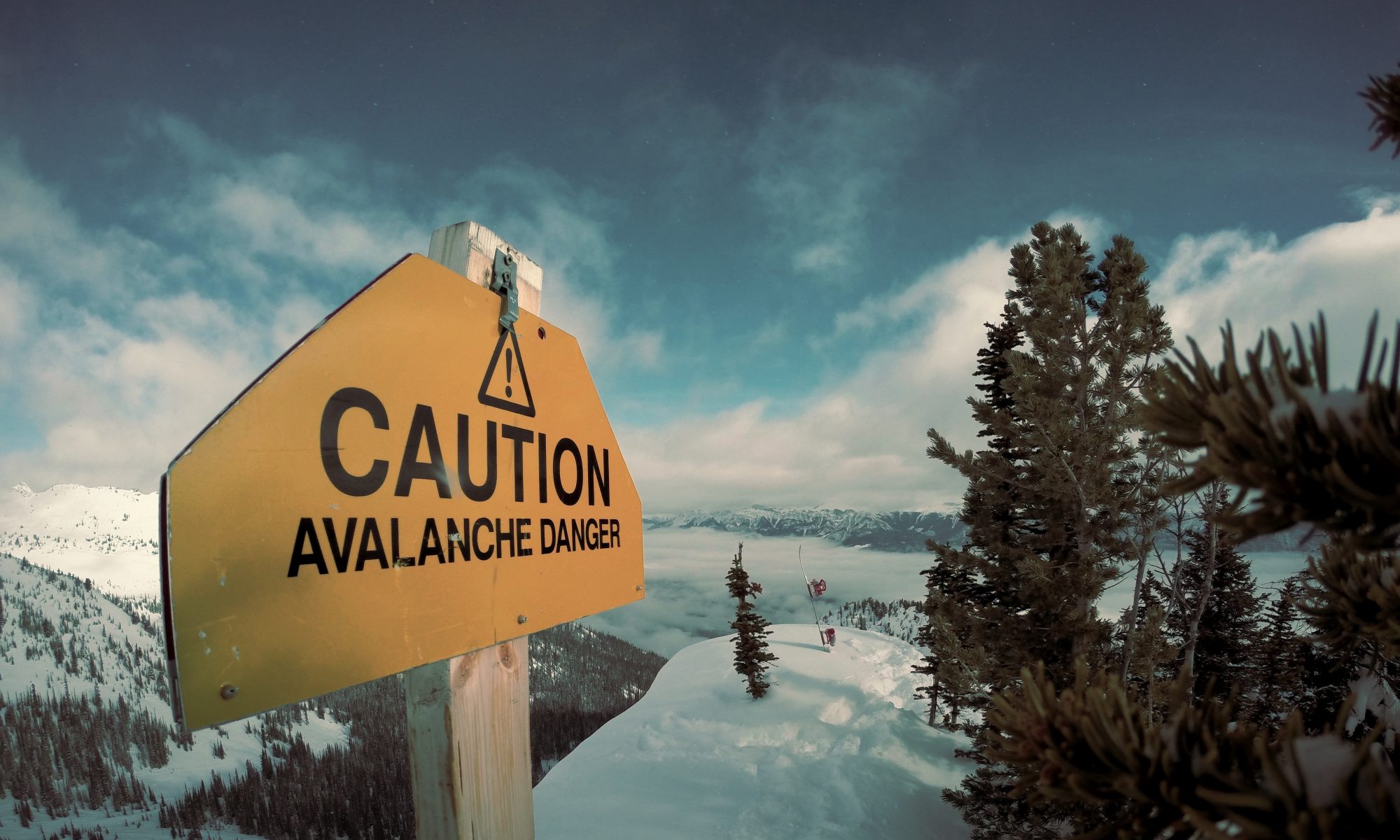 Caution avalanche sign - Photo by Nicolas Cool - Unsplash - Avalanche crashes into hotel in eastern Switzerland.