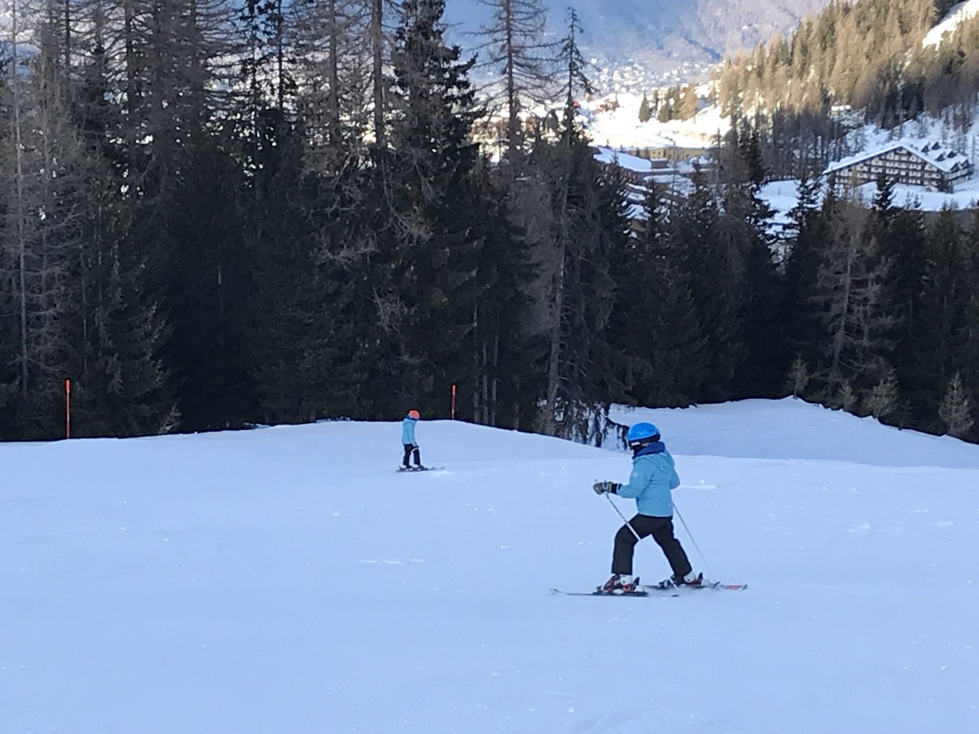 The boys coming down the piste after the steep spot. Photo by: The-Ski-Guru.