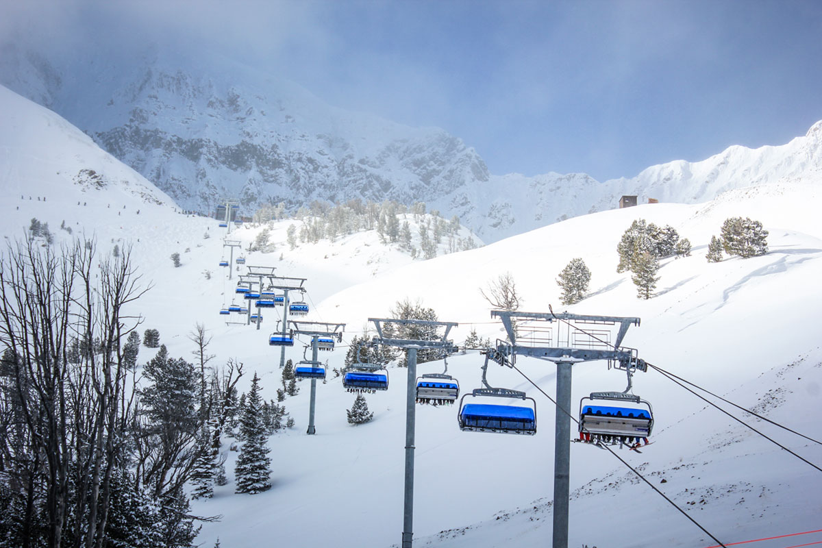 Modern lifts in Big Sky Resort in Montana. Big Sky Resort will be part of the Mountain Collective lift pass for the 2018-19 ski season