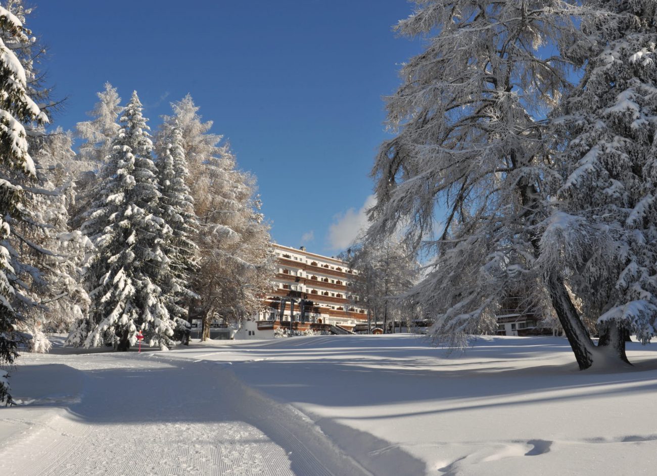 The Grand Hotel du Golf et Palace is next to the golf course in summer and the cross-country trails in winter. Photo: Grand Hotel du Golf et Palace Crans-Montana. 