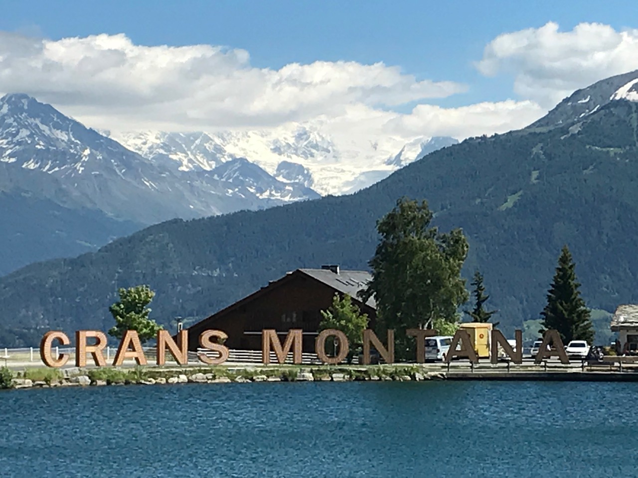 The Crans-Montana letters are by the side of one of the 7 lakes in Crans-Montana. Photo credit: The-Ski-Guru.