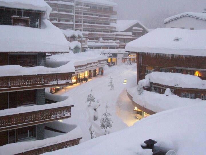 A snowy main road of Crans, where all haute-couture shops are- the place to splash your bonus!