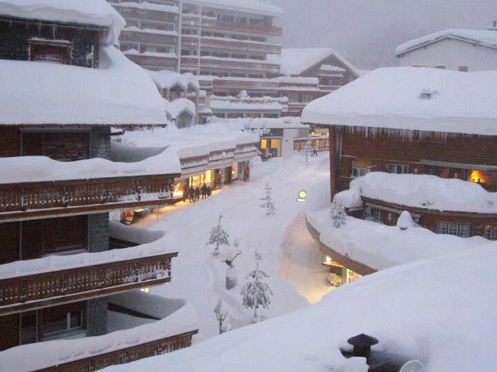 A snowy main road of Crans, where all haute-couture shops are- the place to splash your bonus! 