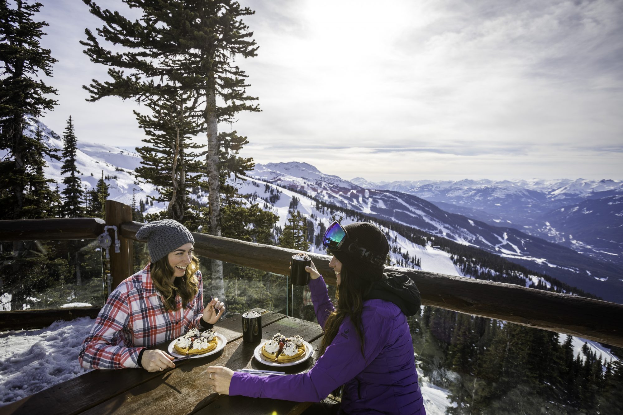 Friends enjoy food and beverages at Crystal Hut in Whistler Blackcomb. Photo: Jeskova - Crystal Hut. Whistler Blackcomb- Vail Resorts. New investments in Whistler Blackcomb to enhance the guest experience will be ready for the 2018-19 ski season.