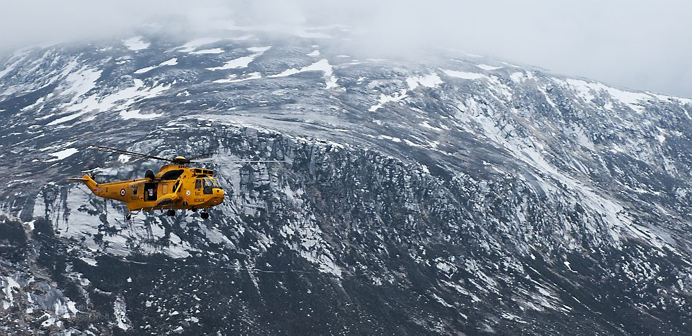 A RAF helicopter flying over the Cairngorms. Cairngorm Mountain's funicular might not open this coming season. 