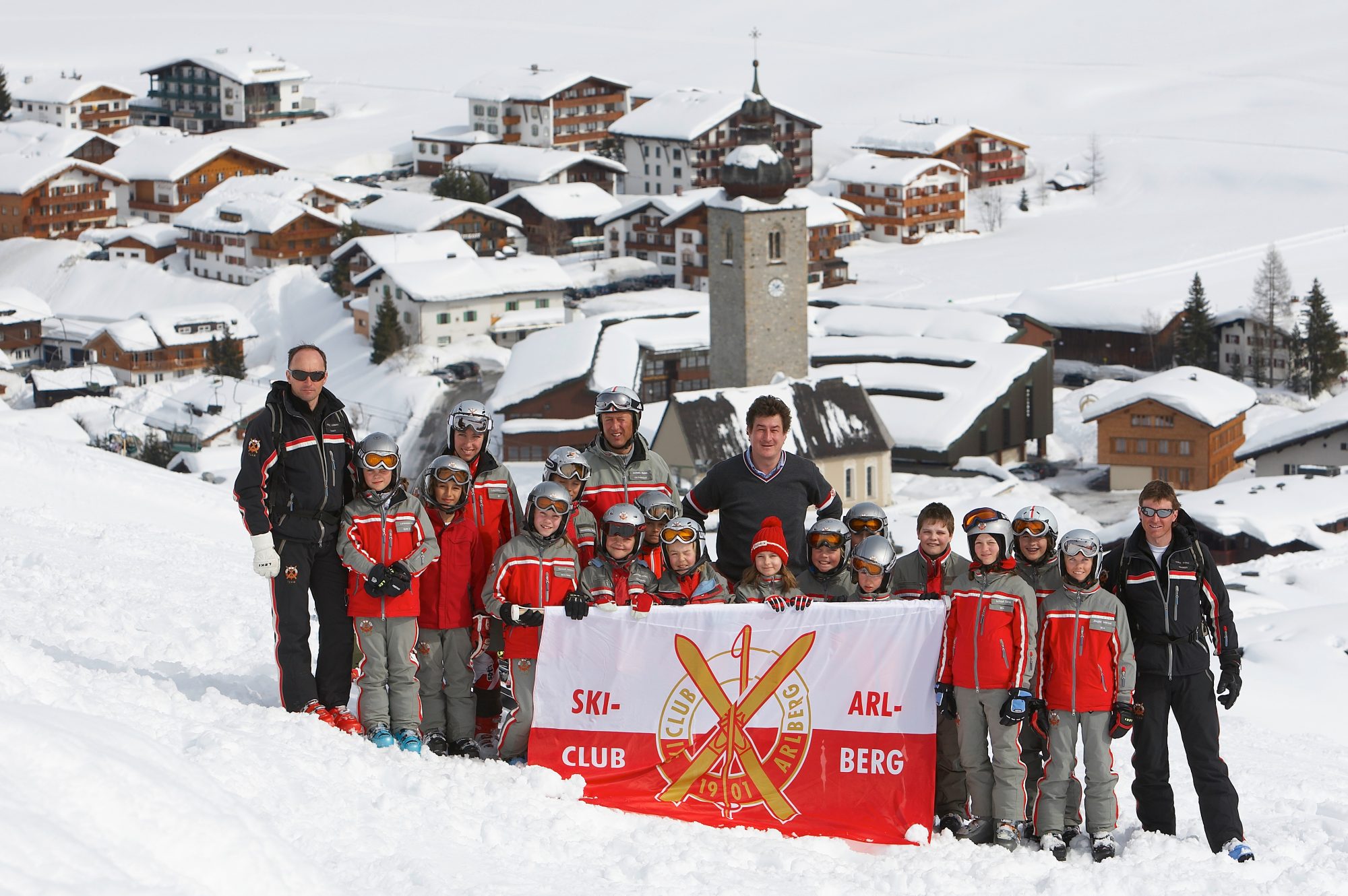 The Ski Club Arlberg posing for a group photo. Photo by Peter Mathis. Lech Zürs Tourismus. The Must-Read Guide to Lech. 