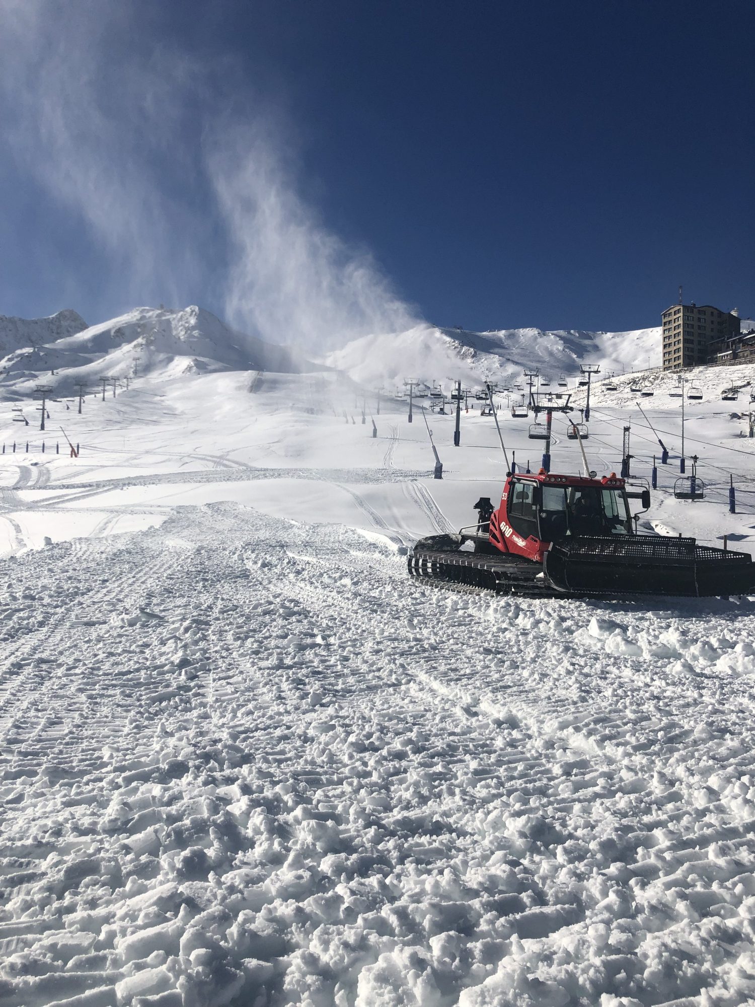 A snowcat is preparing the pistes in the Pas de la Casa Sector of Grandvalira. Grandvalira kick-starts the season this Saturday 1st of December with the partial opening of the Pas de la Casa and Grau Roig sectors.