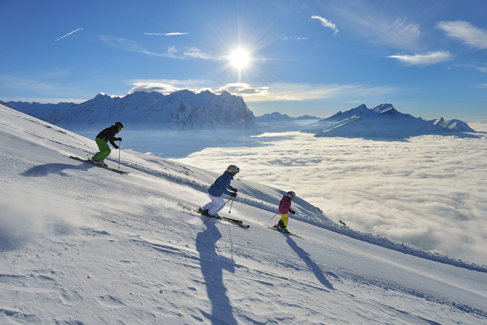 Switzerland. get natural. Skiing fun for the whole family in the ski resort of Meiringen-Hasliberg in the Bernese Oberland. Above the sea of fog in brilliant winter sunshine, the area provides an opportunity for various winter sports activities. Switzerland is giving away 12,770 ski passes for kids. Copyright by: Switzerland Tourism - By-Line: swiss-image.ch/Christian Perret