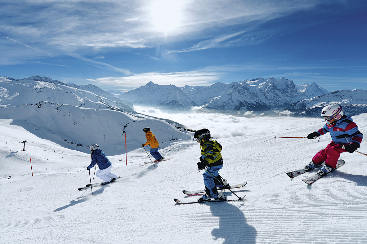 Switzerland. get natural. Skiing fun for the whole family in the ski resort of Meiringen-Hasliberg in the Bernese Oberland. Above the sea of fog in brilliant winter sunshine, the area provides an opportunity for various winter sports activities. Switzerland is giving away 12,770 ski passes for kids. Copyright by: Switzerland Tourism - By-Line: swiss-image.ch/Christian Perret
