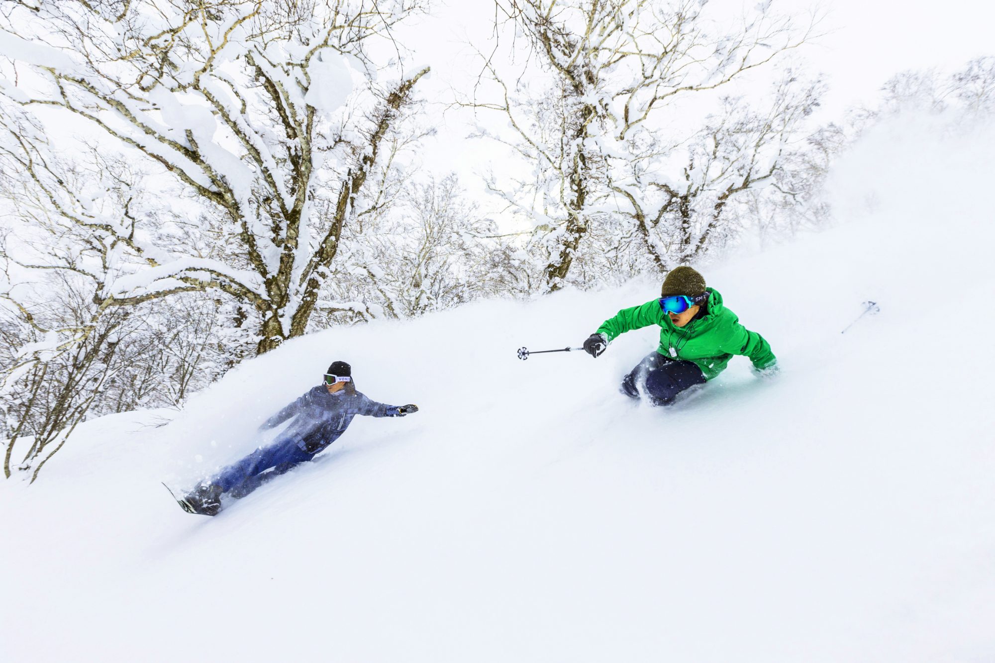 A skier and a boarder enjoying the snow in Rusutsu. Rusutsu, the Japanese Resort joins the EPIC Pass for the 2019-20 ski season.
