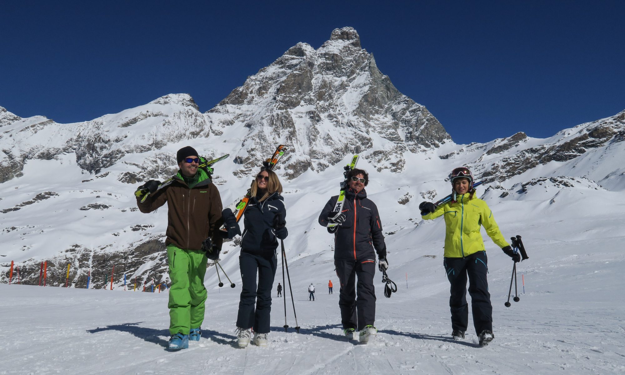 Skiers walking with the Monte Cervino in the backdrop. Photo Enrico Romanzi - Breuil Cervinia. How Italian Ski Resorts are preparing for the ski season.