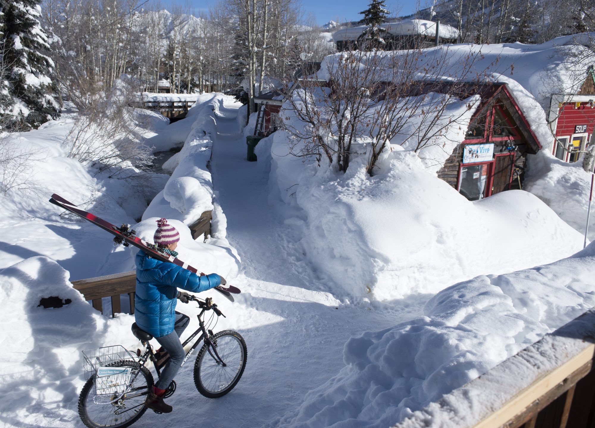 Town Girl on Bike with skis, photo by the late Tom Stillo. Crested Butte Mountain Resort. Crested Butte Mountain Resort Announces Plans to Replace the Teocalli Lift for the 2019-20 Winter Season.