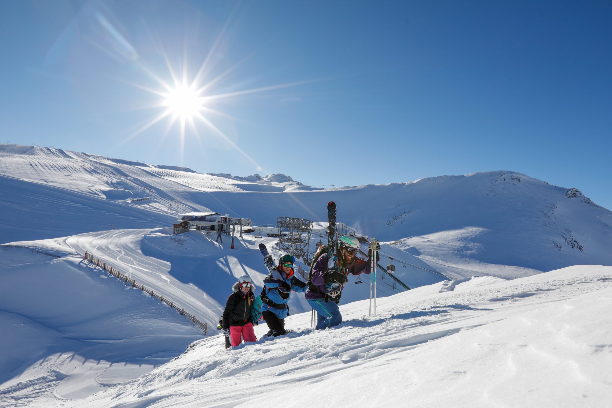 Freestyle skiers climbing up the mountain. Photo b Nils Louna. Les 2 Alpes. What is New at Les 2 Alpes this season.