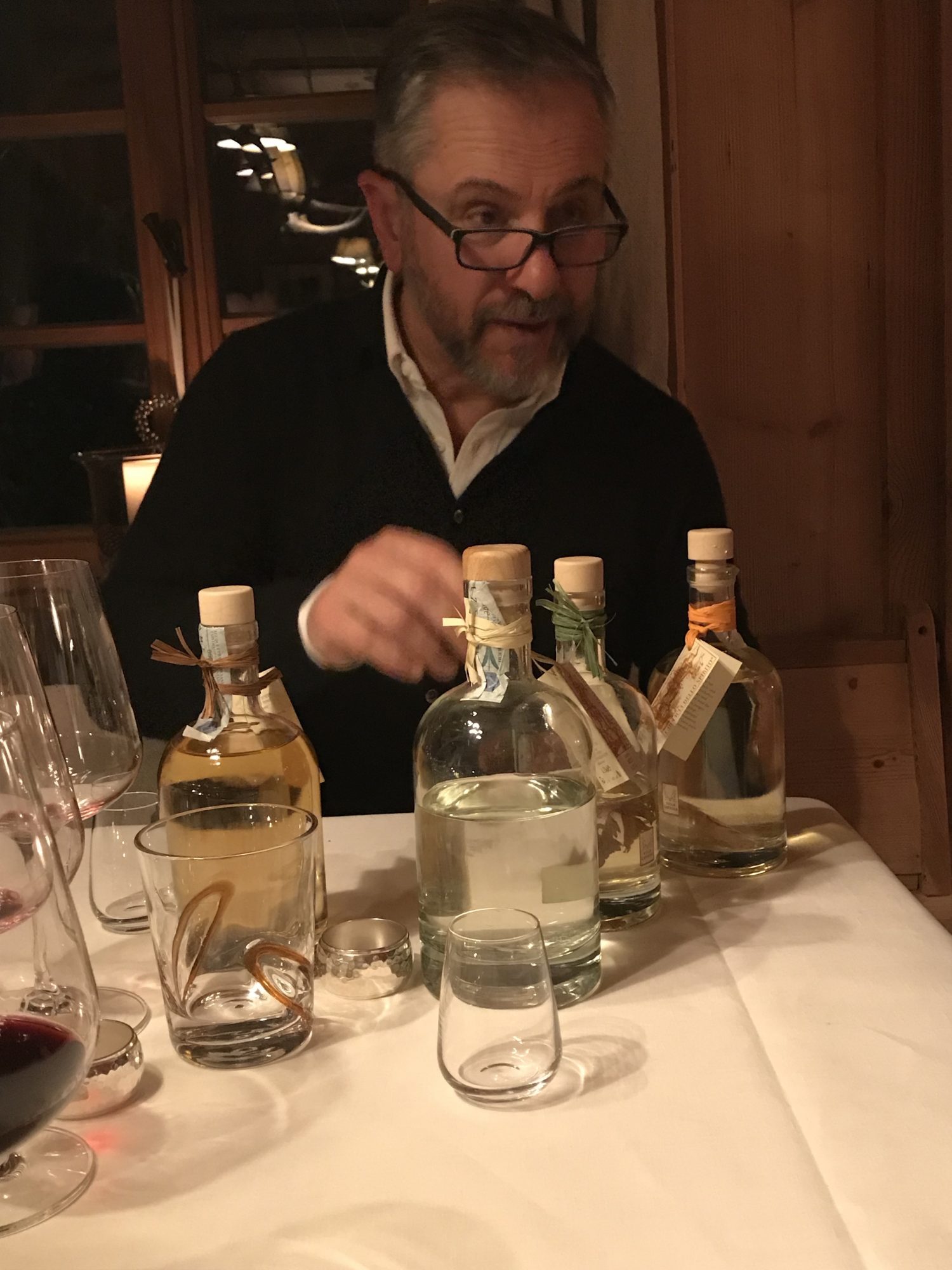Stefano Barbini, the owner of San Lorenzo Lodges, brings some grappas to enjoy after the meal finished. Photo: The-Ski-Guru. Spot on White Deer – San Lorenzo Mountain Lodge.