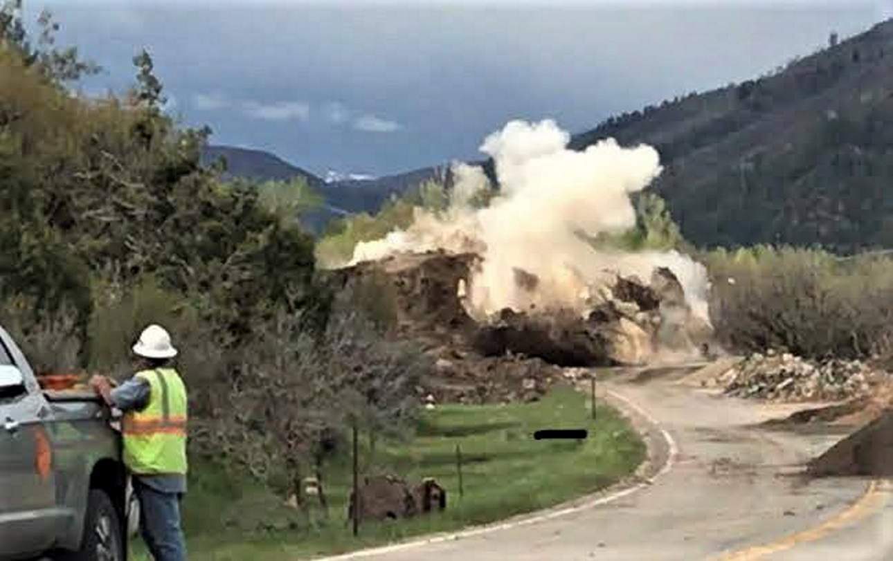 The explosion of the boulder - photo CDOT. A Rockslide, with a boulder of a size of a house, wiped out a section of the highway in SW Colorado