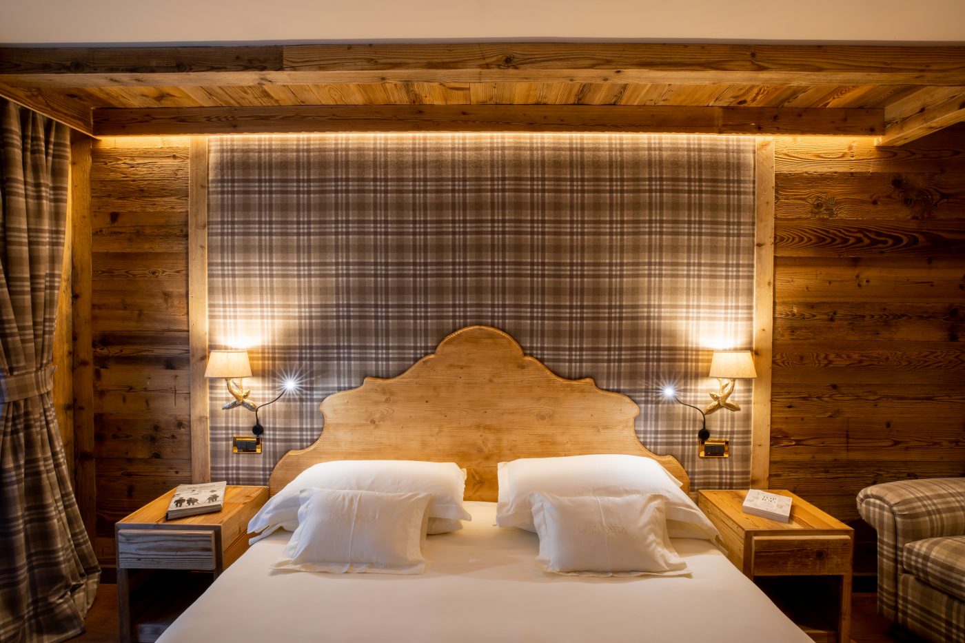 An executive room at the Gran Baita, with wood panelled walls. Spot on: Gran Baita Hotel – Courmayeur