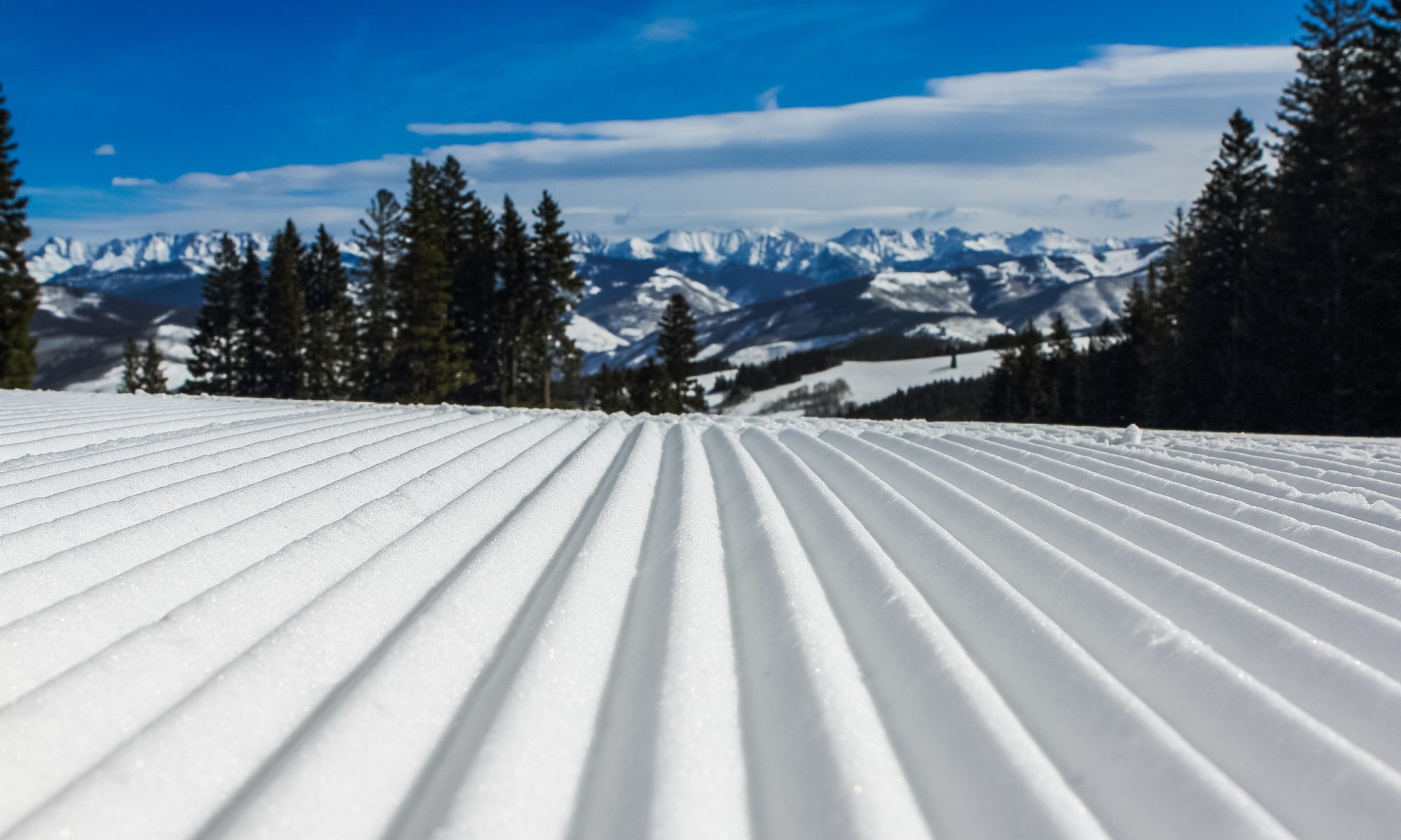 Snow Groomed. Photo by John Price. Unsplash. How can we envision ski resorts opening with social distancing for the 2020-21 ski season?