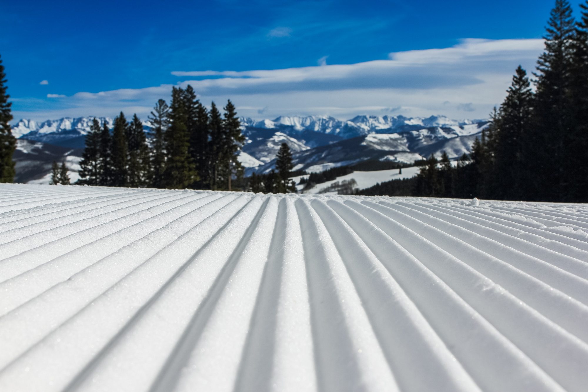 Snow Groomed. Photo by John Price. Unsplash. How can we envision ski resorts opening with social distancing for the 2020-21 ski season?