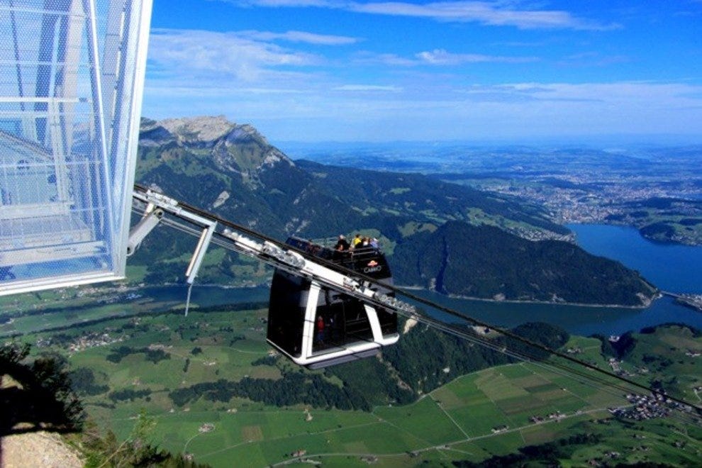 The Stanserhorn Cabrio is arriving to the top station in Stanserhorn mountain. Stranded tourists heli-ported after Stanserhorn CabriO cable car breakdown.