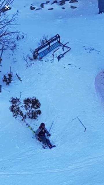 The skier with the broken chair. Skier falls from chairlift in Threbdo after becoming dislodged due to strong winds. 