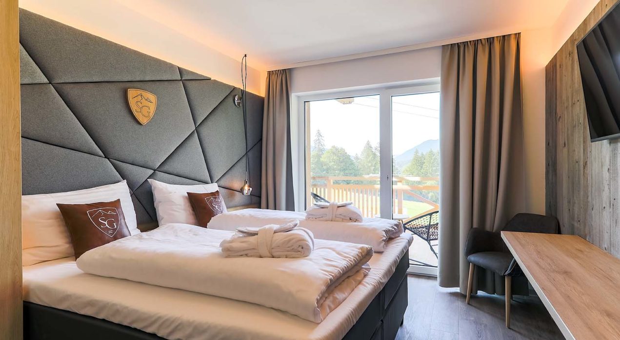 A bedroom in the new apartments for sale in Hinterglemm, Austria. How to buy a home in the mountains.