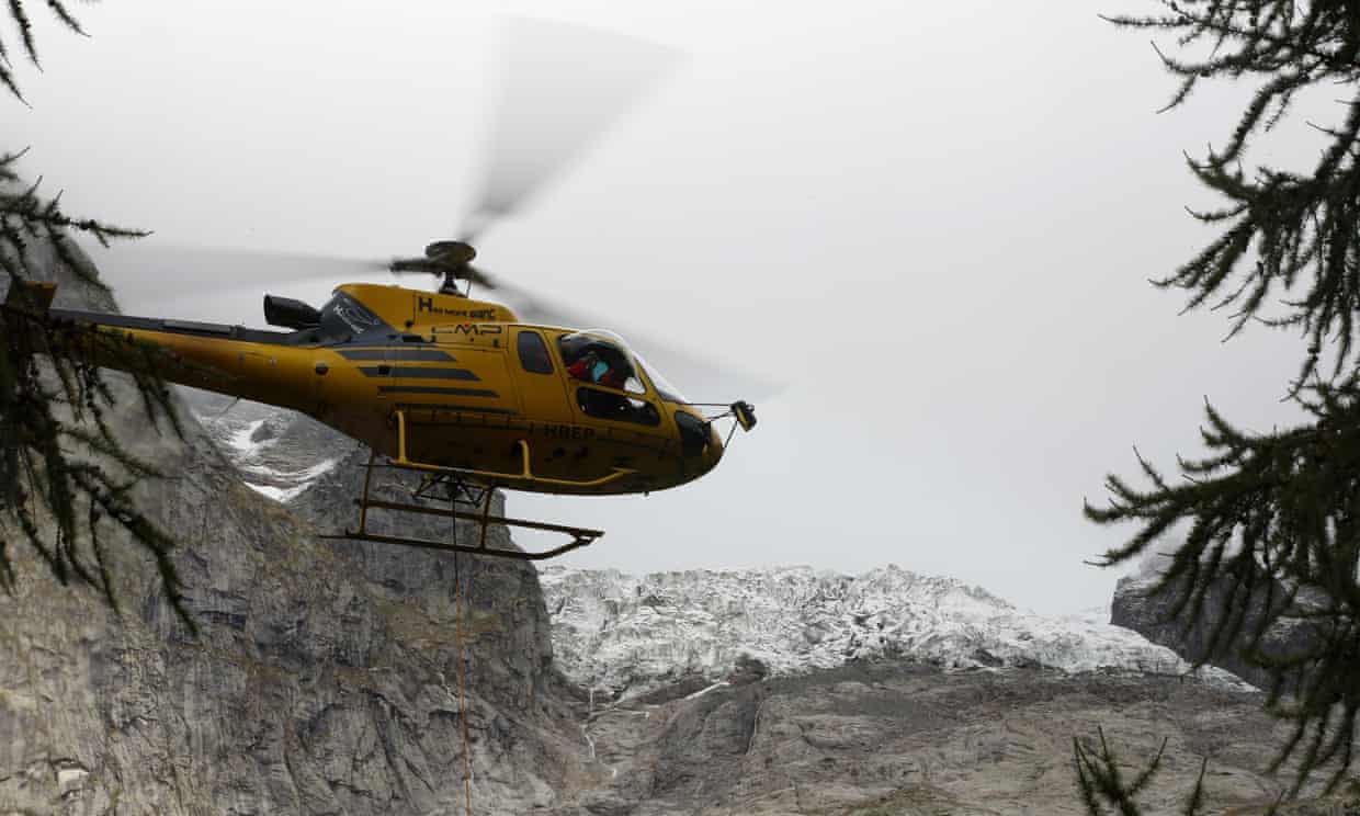 A helicopter rides on top of the glacier. Photo: Antonio Calanni AP - The Guardian. A fast-melting glacier in the Mont Blanc raised an alarm in the area of Val Ferret of Courmayeur. 