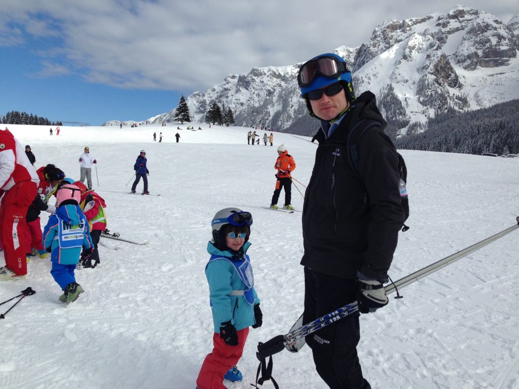 My youngest with my husband after his ski lesson in Madonna di Campiglio. 7 things that can help you when taking kids skiing.