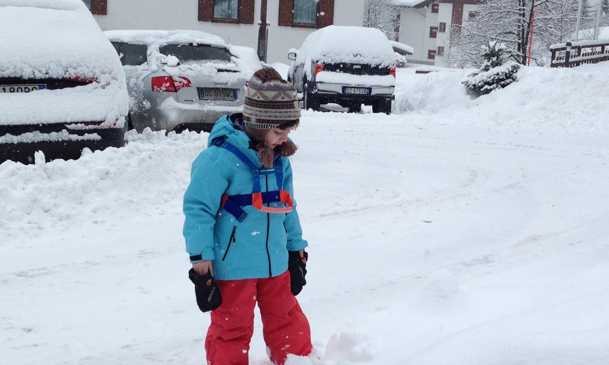 My youngest wearing his ski harness before going skiing in Madonna di Campiglio. 7 things that can help you when taking kids skiing.