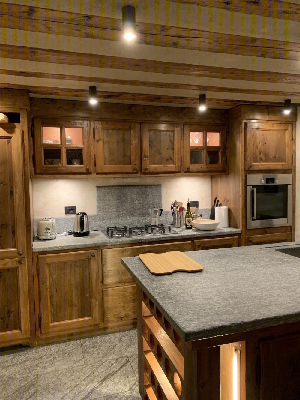 The kitchen of the apartment Il Cuore della Valdigne, all made in stone and wood, with the pan de bois on the ceiling. Aiguille du Midi vs Punta Helbronner – which one you should do?