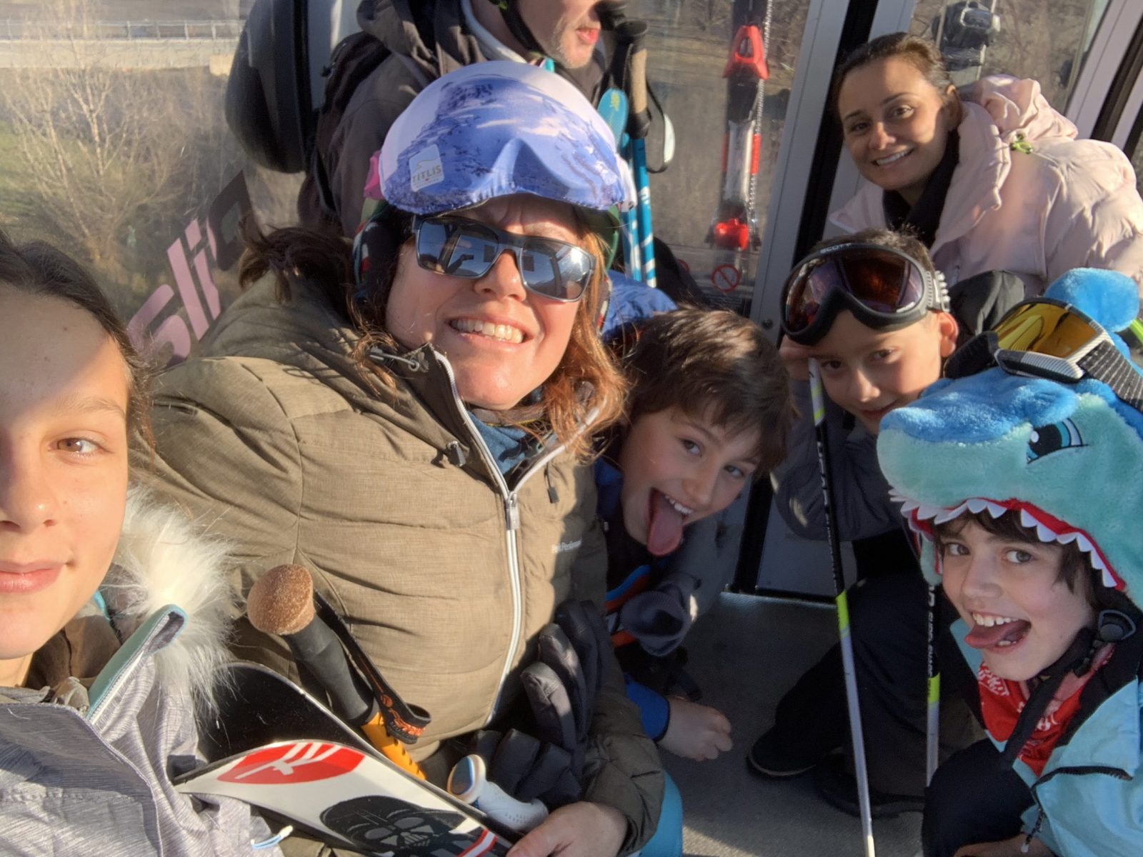 Going up the gondola with our friends. First day of skiing for them, but their eldest daughter. Our Christmas holidays in the mountains with the kids and our dog! Courmayeur, Aosta.