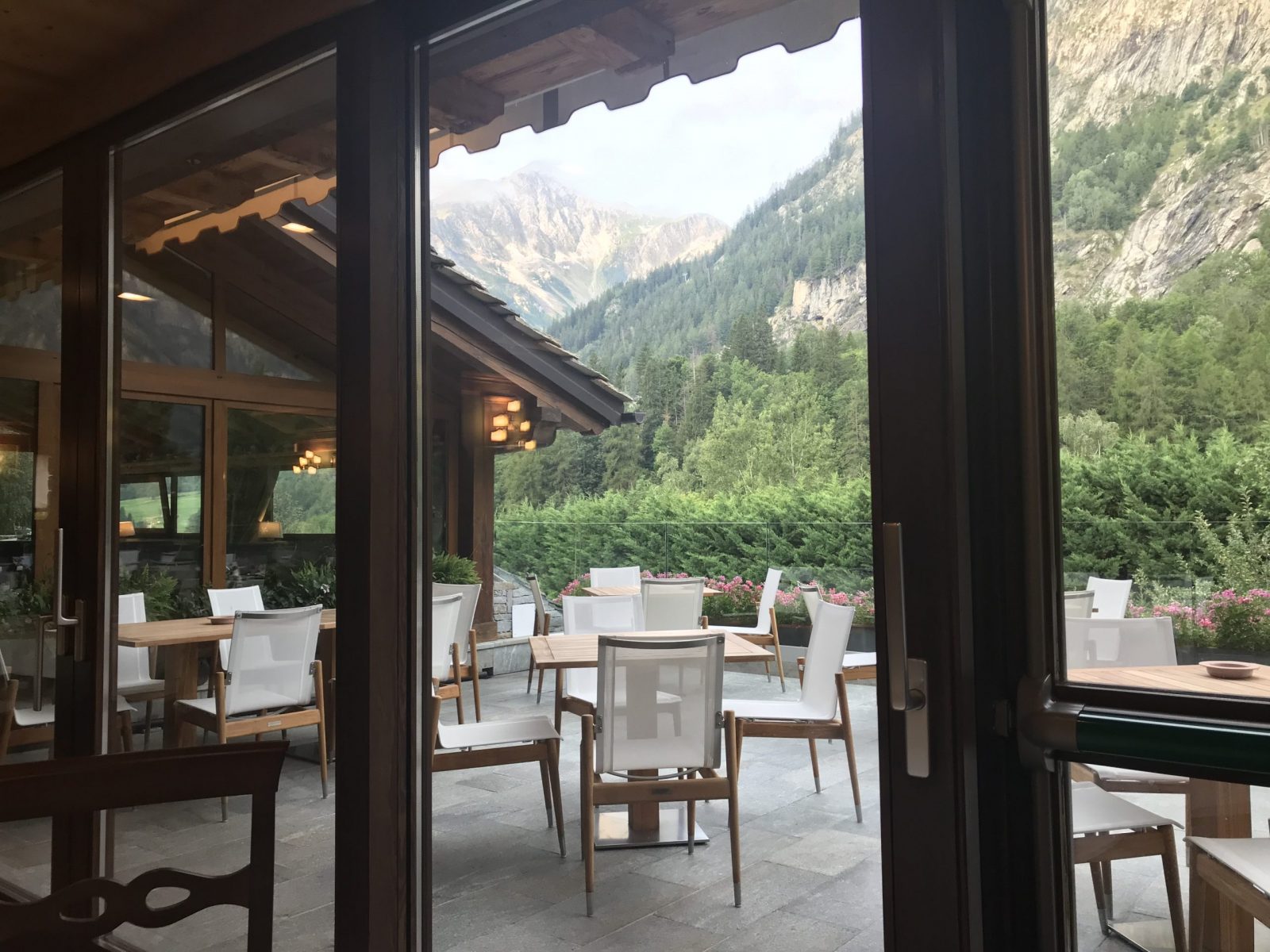 The view of the terrace of the Gran Baita Hotel breakfast room/dining room. My experience of buying a home in the Italian Alps.