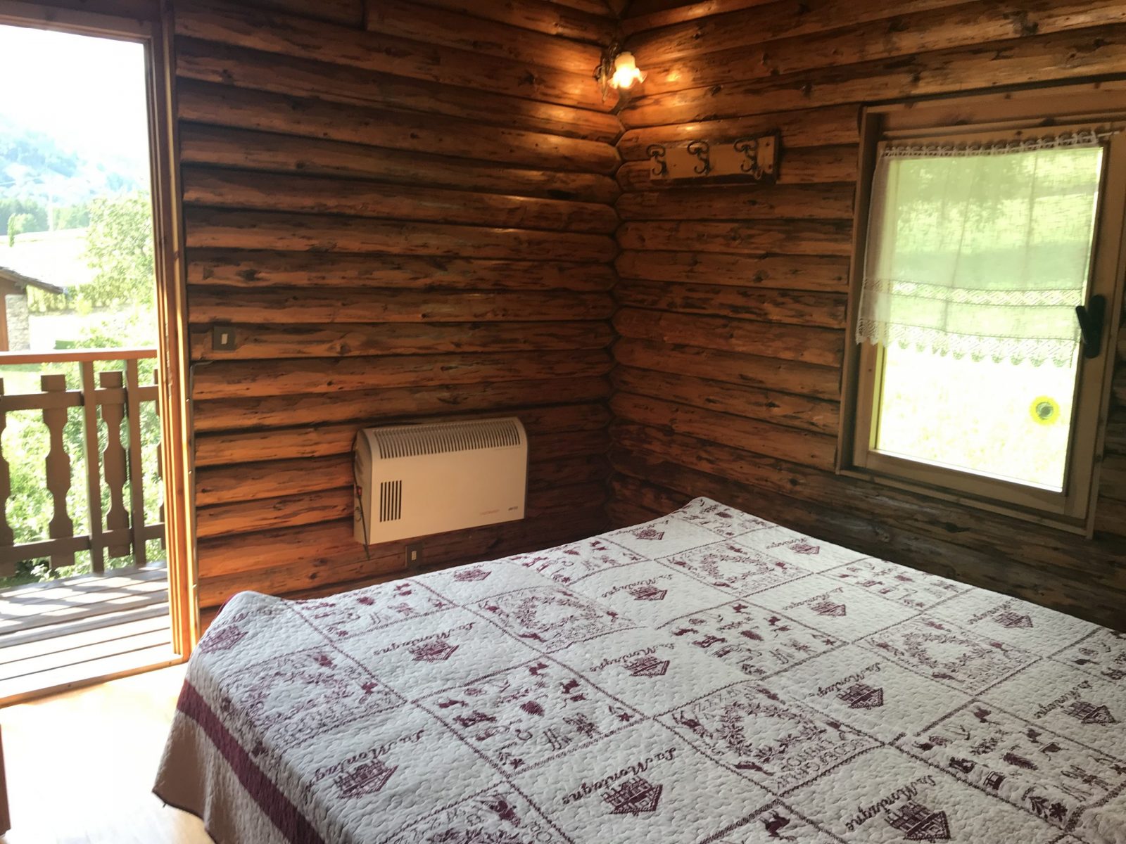 The log main bedroom of the house in Chabodey. My experience of buying a home in the Italian Alps.