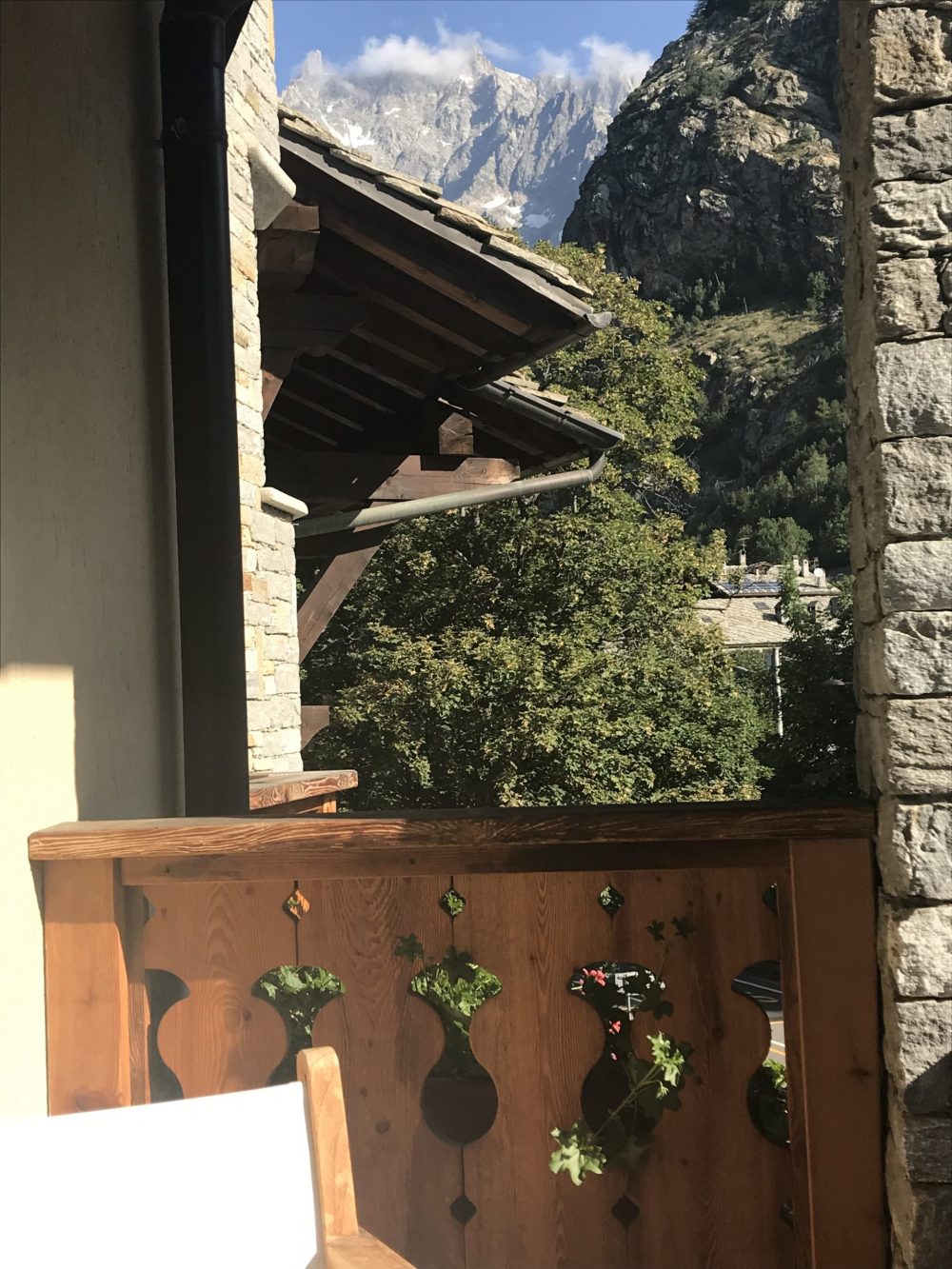 The balcony at the Gran Baita Hotel with a view of the Dente del Gigante - even though a cloud is covering it at the time. My experience of buying a home in the Italian Alps.