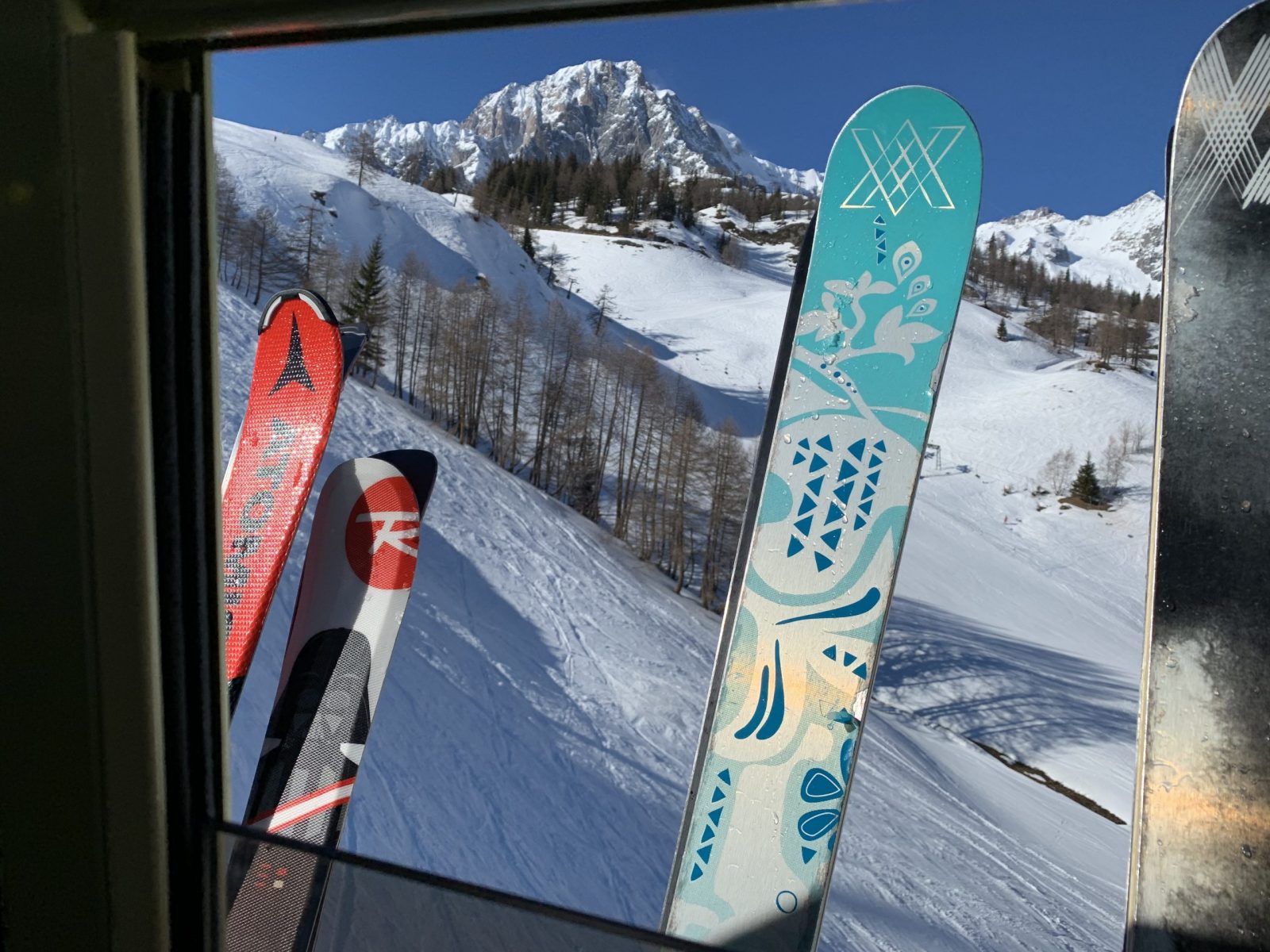 Our skis going up the cablecar Chécrouit. Our half term ski-safari holiday based in the Valdigne of Aosta Valley- Courmayeur, Pila and La Thuile.