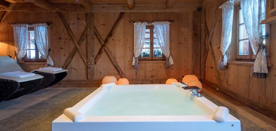 part off the indoor spa at the White Deer Lodge. The Lodge also has an outdoor pool with magnificent views on top of the town of San Lorenzo. A Must-Read Guide to Summer in South Tyrol.
