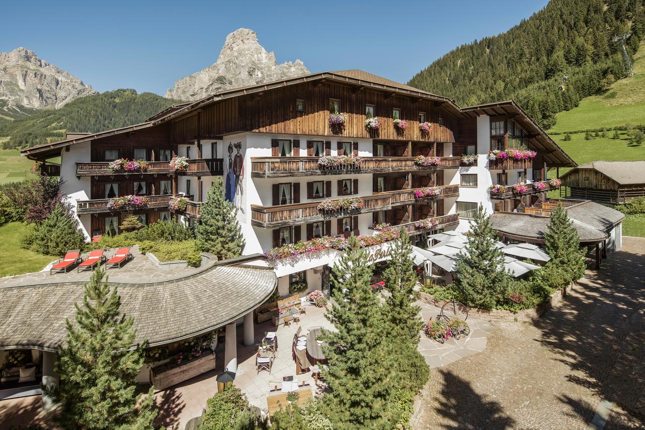 Exterior of Hotel La Perla in Corvara. Book your stay at Hotel La Perla here. Planning your summer in the mountains of Alta Badia. 