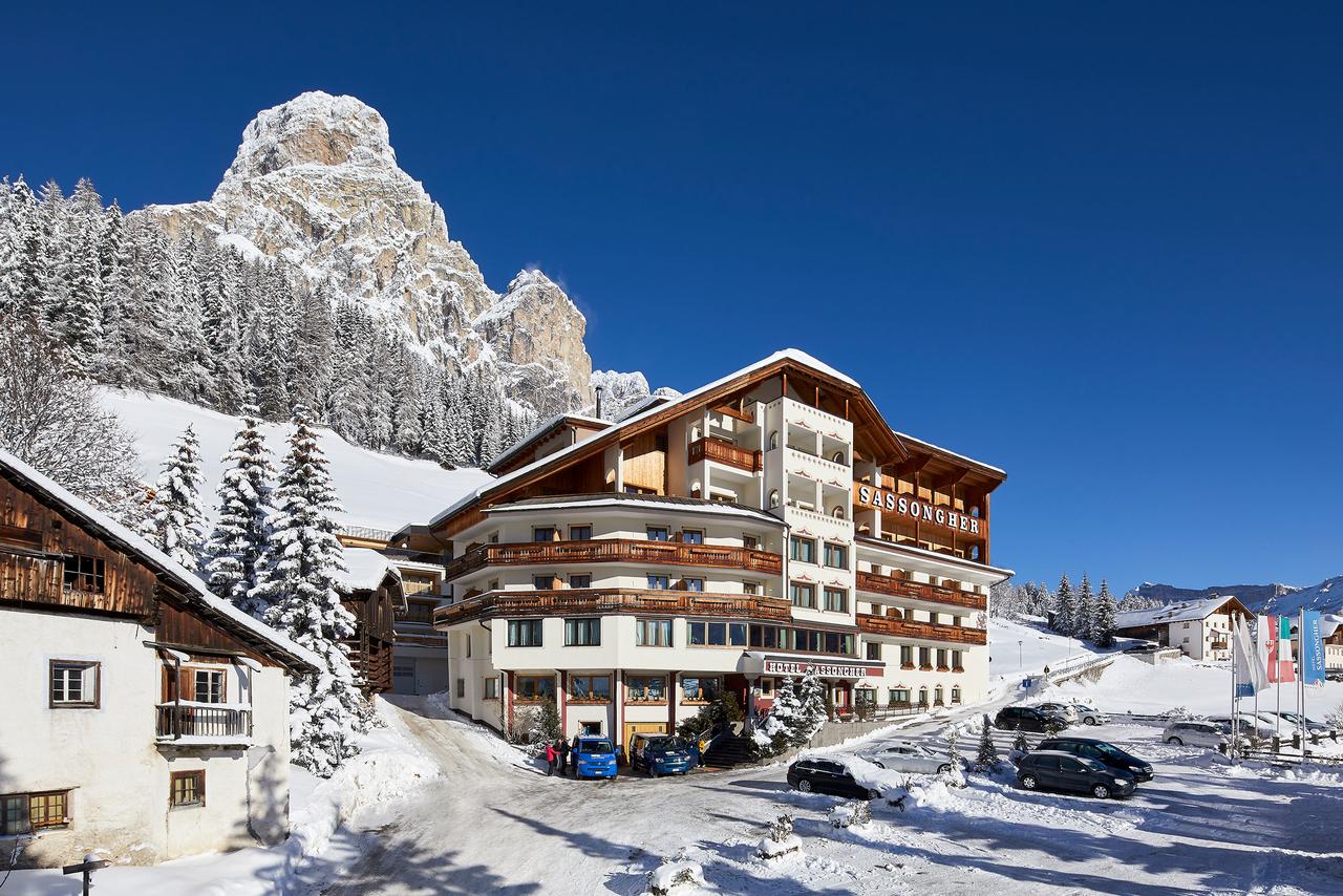 Exteior of the Hotel Sassongher in Alta Badia in winter. Book your stay at the Hotel Sassongher here. Plan your summer in the mountains of Alta Badia. 
