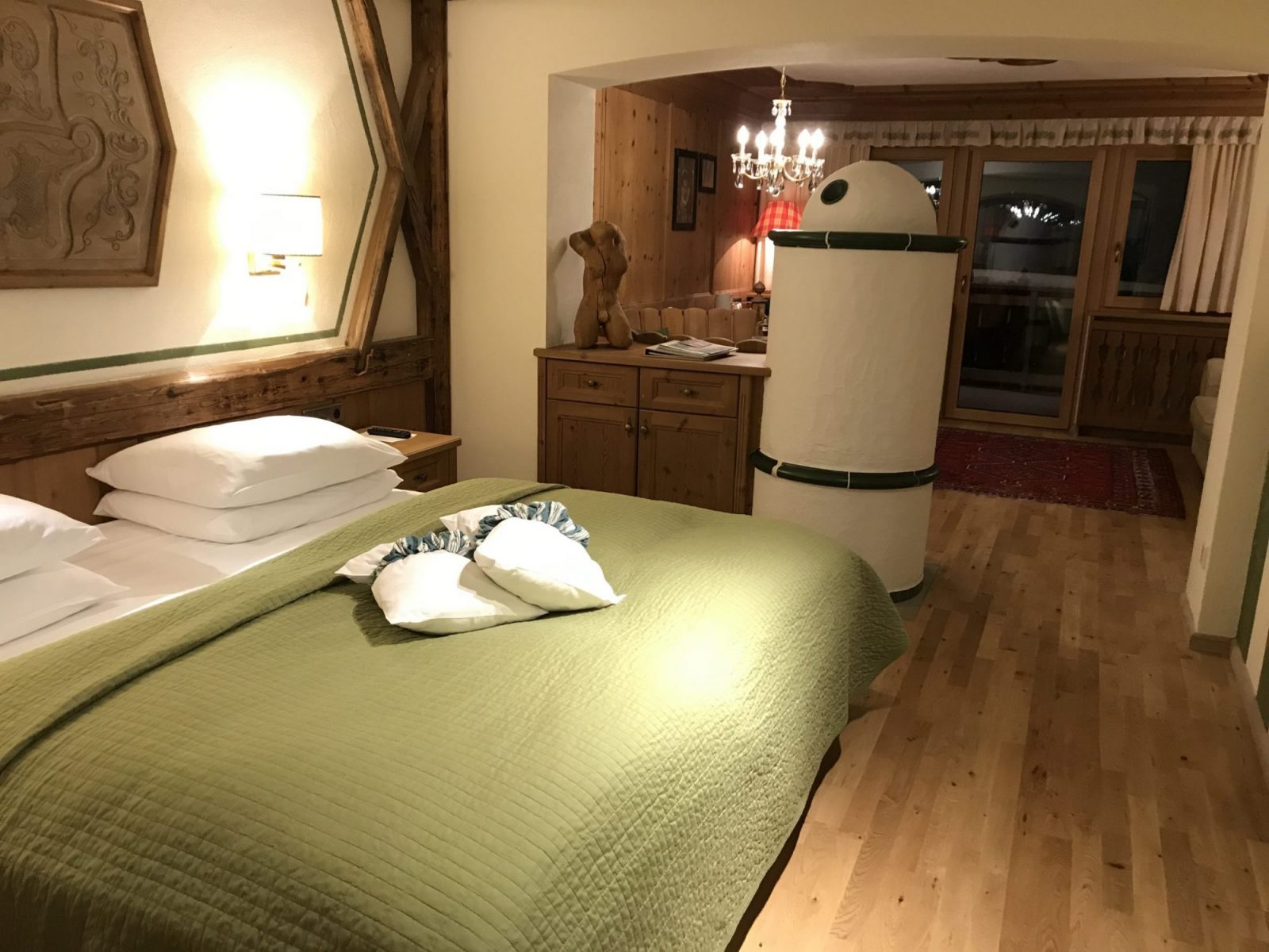 A room at the Hotel La Perla with its typical stove. Book your stay at the Hotel La Perla here. Planning your summer in the mountains of Alta Badia.