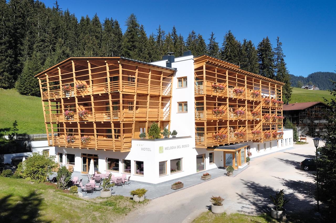 Exterior of the Hotel Melodia del Bosco. Book your stay at the Melodia del Bosco here. Planning your summer in the mountains of Alta Badia. 