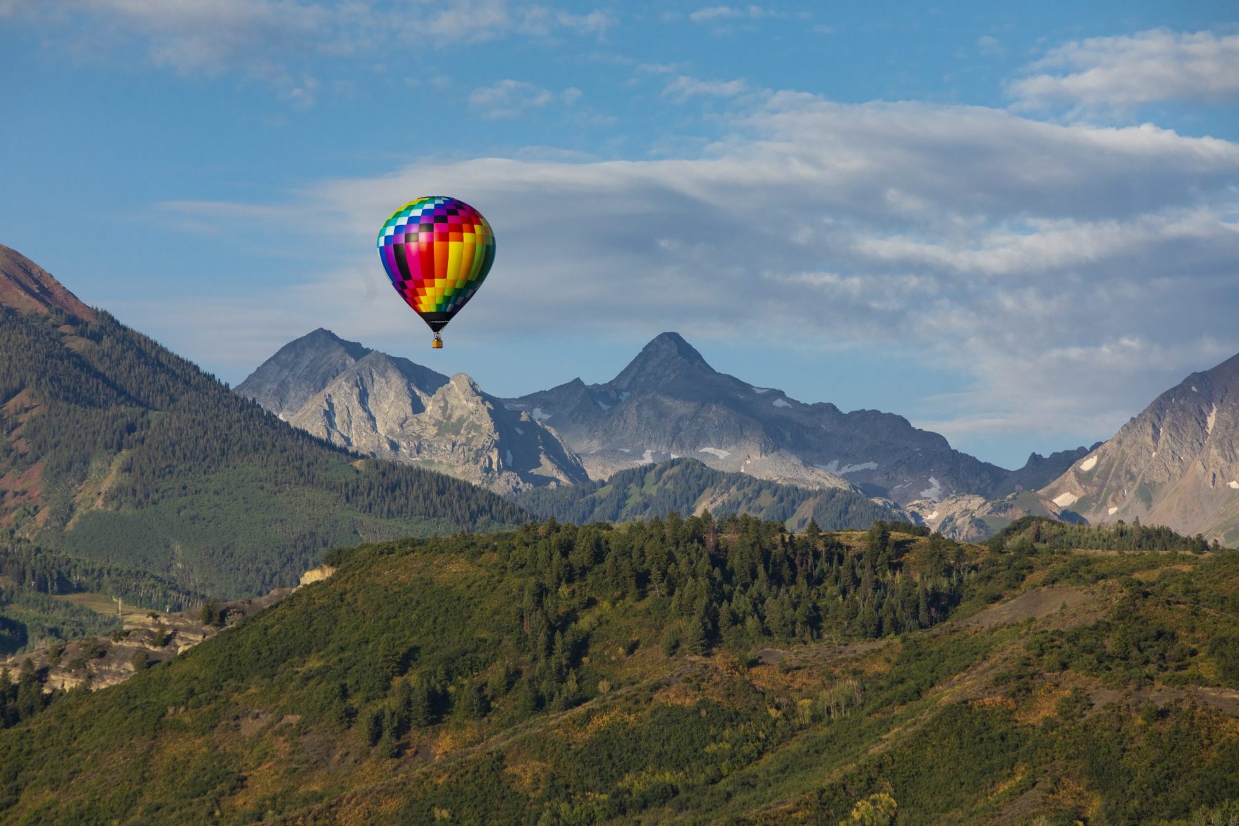 A hot-air balloon on top of the skyline. Photo: Aspen Skiing Company. Aspen Snowmass is opening for the Summer Season.
