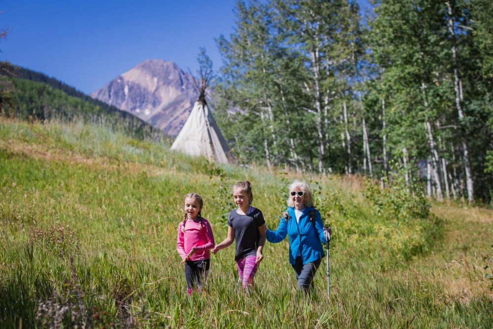 A family enjoying the great outdoors. Photo: Aspen Skiing Company. Aspen Snowmass is opening for the Summer Season.