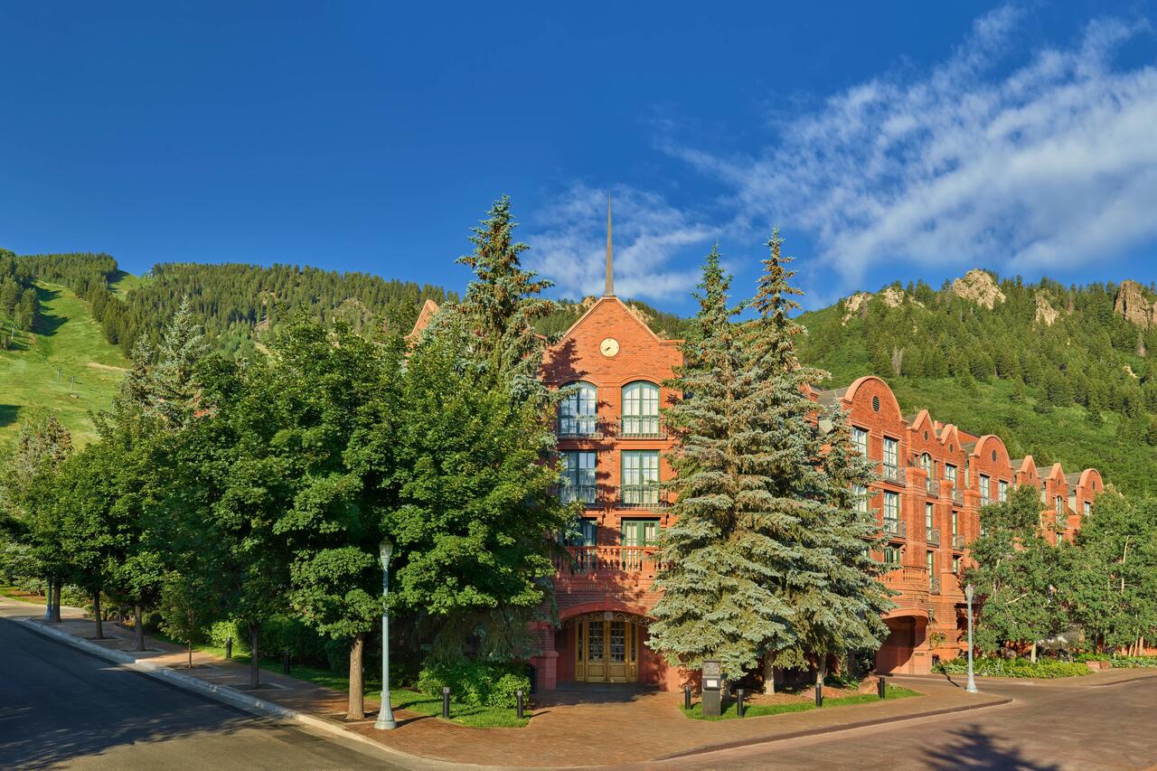 Exterior of the St Regis in Aspen, on the base of Aspen Mountain. Book your stay at the St Regis here. Aspen Snowmass is opening for the Summer Season.