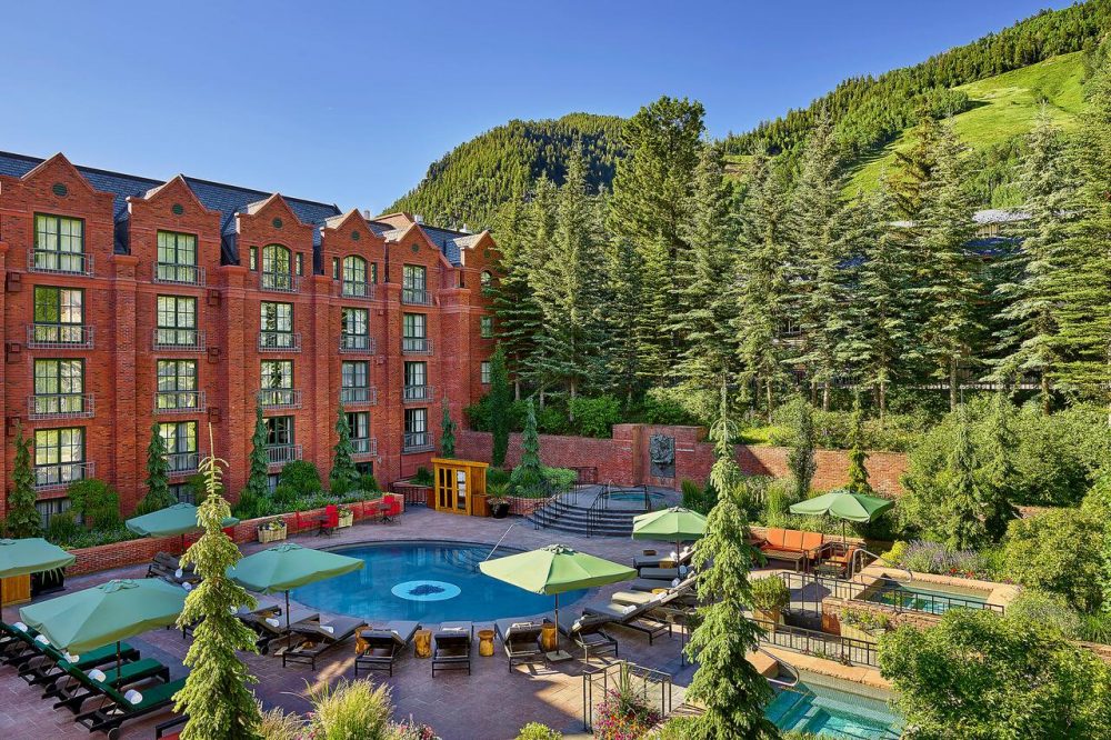 The outside of the pool at the St Regis in Aspen. Book your stay at the St Regis here. Aspen Snowmass is opening for the Summer Season.