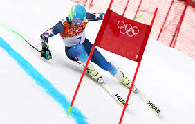 Ted Ligety skiing down the gates. To extend or not to extend… that is the question.